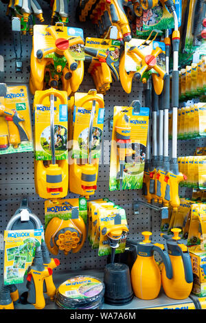 Display of Hozelok proprietary hose fittings on display in a garden centre Stock Photo