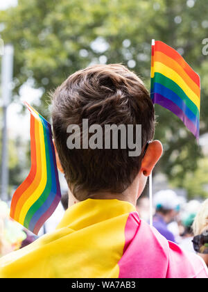 Essen, Germany. 10 August 2019. Ruhr CSD in Essen. Participant with rainbow flags, Christopher Street Day. Stock Photo