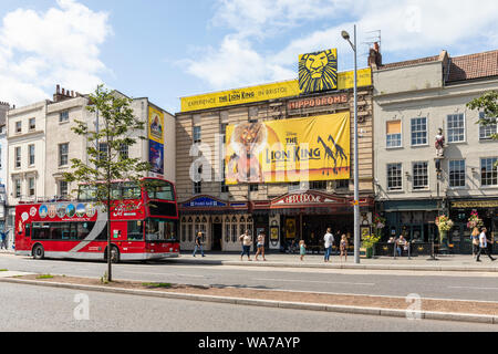 Bristol Hippodrome Theatre advertising Disney The Lion King with a Bristol Insight red open top bus outside, St Augustine's Parade, City of Bristol UK Stock Photo