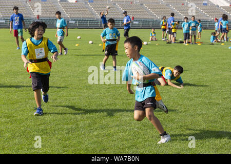 Kamaishi, Japan. 18 August 2019.  Elementary-school children from Taiwan, Australia and Japan take part during the ''Kamaishi Kids Try'' sports event at Kamaishi Unosumai Memorial Stadium. The ''Tohoku Media Tour: Iwate Course'' is organized by the Tokyo Metropolitan Government in collaboration with local authorities to showcase the recovery efforts in Tohoku area affected by the 2011 Great East Japan Earthquake and Tsunami.  The Credit: ZUMA Press, Inc./Alamy Live News Stock Photo