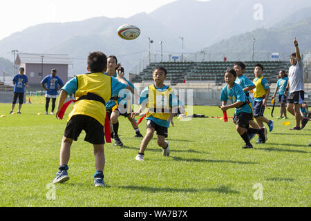 Kamaishi, Japan. 18 August 2019.  Elementary-school children from Taiwan, Australia and Japan take part during the ''Kamaishi Kids Try'' sports event at Kamaishi Unosumai Memorial Stadium. The ''Tohoku Media Tour: Iwate Course'' is organized by the Tokyo Metropolitan Government in collaboration with local authorities to showcase the recovery efforts in Tohoku area affected by the 2011 Great East Japan Earthquake and Tsunami.  The Credit: ZUMA Press, Inc./Alamy Live News Stock Photo