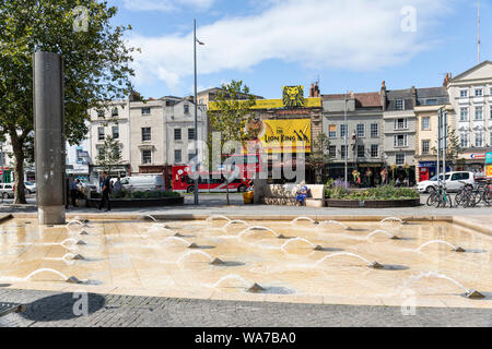 Bristol Hippodrome Theatre advertising Disney The Lion King with a Bristol Insight red open top bus outside, St Augustine's Parade, Bristol, UK Stock Photo