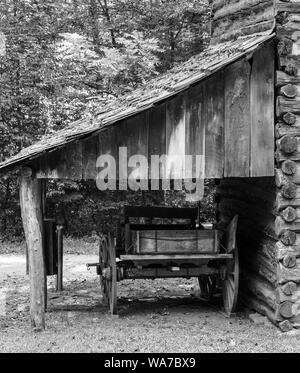 Wooden cart under wooden canopy next to tobacco storage building - Booker T Washington National Monument. Stock Photo