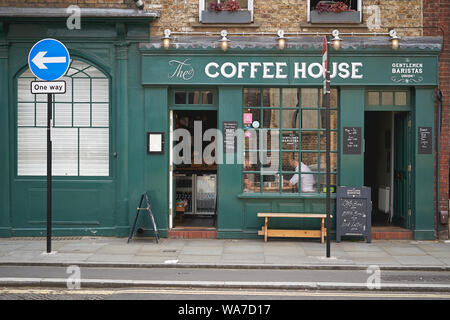 London, UK - August, 2019. View of people having coffee in a coffee shop through the shop window in central London. Stock Photo