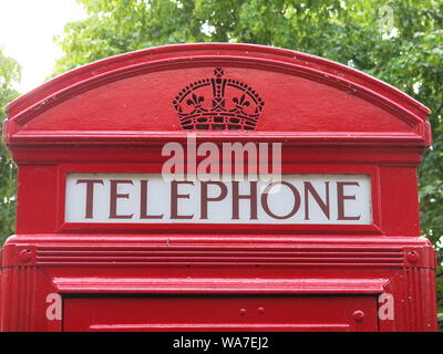 Photo of an iconic piece of British design, the top of the old-fashioned and much-loved red telephone box that used to be on every street corner. Stock Photo