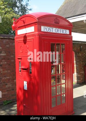Photo of an iconic piece of British design, the old-fashioned and much-loved red telephone box that used to be on every street corner. Stock Photo
