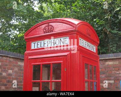 Photo of an iconic piece of British design, the old-fashioned and much-loved K2 model of red telephone box that was introduced in London in the 1920s. Stock Photo