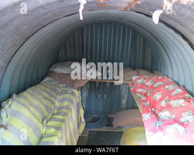 Interior view of an Anderson Shelter with sleeping bags for family accommodation during bomb blasts in World War Two Stock Photo