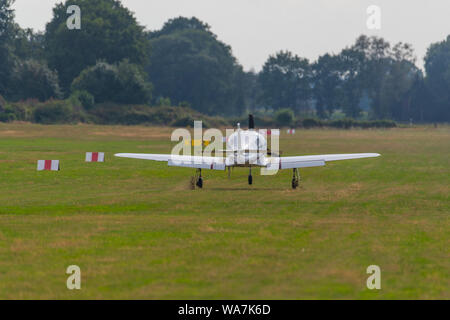 a  landing plane on a small airfield Stock Photo