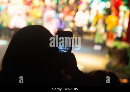Buenos Aires, Argentina. People photographing and making videos with smartphones and other high-tech devices, in a theater. Stock Photo