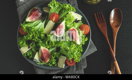 salad with figs cheese and tomatoes, vegetable dish Stock Photo