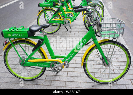London, UK - August  2019: Dockless Lime-E green electric bike on a street in central London. Lime is a Californian Bike sharing transportation compan Stock Photo