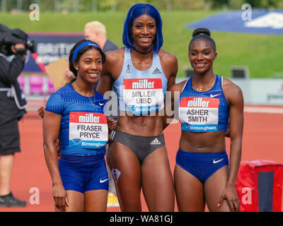 Shelly-Ann Fraser-Pryce of Jamaica (third place), Shaunae Miller-Uibo of The Bahamas (first) and Dina Asher-Smith of Great Britain (second) pose after winning the women's 200 metres, during the Birmingham 2019 Müller Grand Prix, at the Alexander Stadium, Birmingham, England. Stock Photo