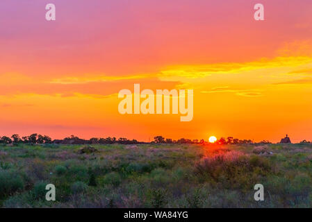 Sunset background, Panorama view with wonderful golden yellow sky, Amazing purple and orange sky in evening during the sun going down. Stock Photo