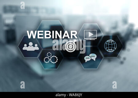 Webinar on virtual screen. Inscription on blurred office background. Stock Photo