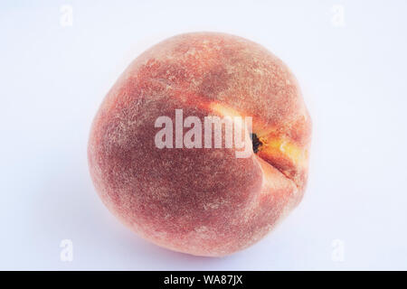 Red peach with leaf isolated on white background. Full depth of field (all details in focus). Clipping path included. Stock Photo