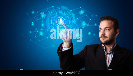 Man touching hologram screen displaying keys and locks Stock Photo