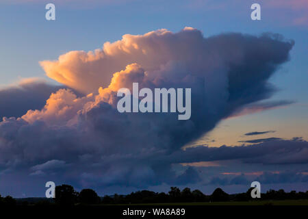 rising Cumulonimbus clouds in Suffolk, UK Stock Photo