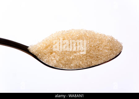 brown cane sugar on spoon Stock Photo