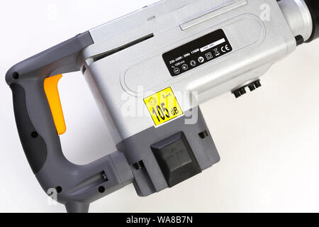 noise level label showing 105 decibels on industrial power drill which requires hearing protection to be used by the operator Stock Photo