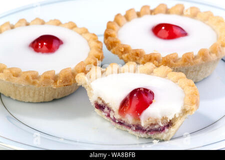 iced cherry bakewell tarts Stock Photo