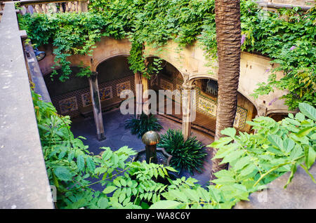 Interior wiews of 'Casa de l'Ardiaca' garden and fountain in Barcelona, now harboring the Historic Archive of the City of Barcelona. Stock Photo