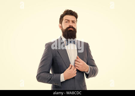 Classy style. Man bearded hipster wear classic suit outfit. Formal outfit.  Take good care of suit. Elegancy and male style. Businessman or host  fashionable outfit grey background. Fashion concept Stock Photo