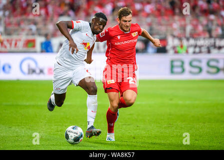 (190819) -- BERLIN, Aug. 19, 2019 (Xinhua) -- Nordi Mukiele (L) of Leipzig vies with Christopher Lenz of Union Berlin during a German Bundesliga match between 1.FC Union Berlin and RB Leipzig in Berlin, capital of Germany, on Aug. 18, 2019. Leipzig won 4-0. (Photo by Kevin Voigt/Xinhua) Stock Photo