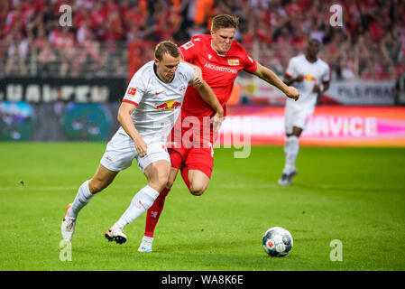 (190819) -- BERLIN, Aug. 19, 2019 (Xinhua) -- Lukas Klostermann (L) of Leipzig vies with Marius Buelter of Union Berlin during a German Bundesliga match between 1.FC Union Berlin and RB Leipzig in Berlin, capital of Germany, on Aug. 18, 2019. Leipzig won 4-0. (Photo by Kevin Voigt/Xinhua) Stock Photo