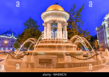 Moscow, Russia - July 6, 2019: The monument fountain-rotunda to Alexander Pushkin and Natalia Goncharova in Moscow at night. Stock Photo