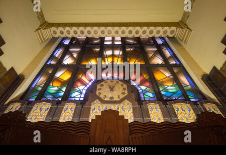 An octagonal clock and stained glass over the entrance of the Art Deco-inspired Marine Building in Vancouver, British Columbia, Canada. Stock Photo