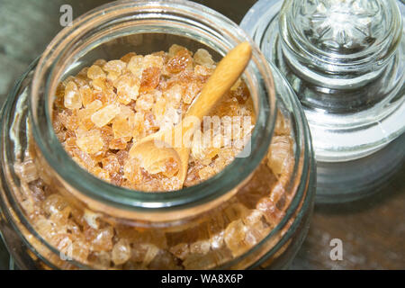 Chrystals of Candi Sugar ,Rock Sugar in glass Bottles. Stock Photo