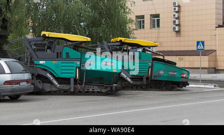 Kazakhstan, Ust-Kamenogorsk – 22 May, 2019. Special equipment for road construction. Asphalt pavers on parking lot. Asphalt paver machine Vogele. Stock Photo