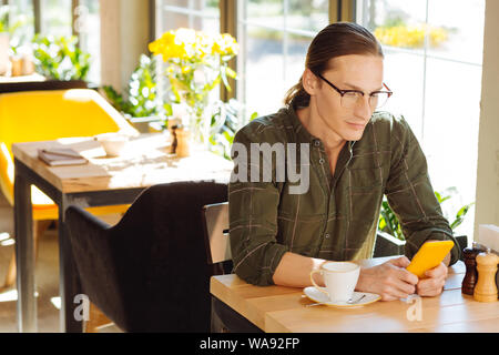 Nice good looking man using social media Stock Photo