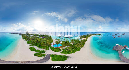 360 degree panoramic view of Aerial spherical panorama of tropical paradise beach  on tiny Maldives island. Turquoise ocean and white sand. Small bungalows between coconut palm tr