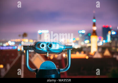 Tallinn, Estonia. Coin Operated Telescope Binocular For Sightseeing At Night Town Tallinn Background Stock Photo