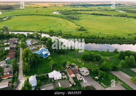 Golovintsy, Gomel Region, Belarus. Aerial View OF Village With Old Wooden Orthodox Church Of The Protection Of The Holy Virgin, Intercession Church At Stock Photo