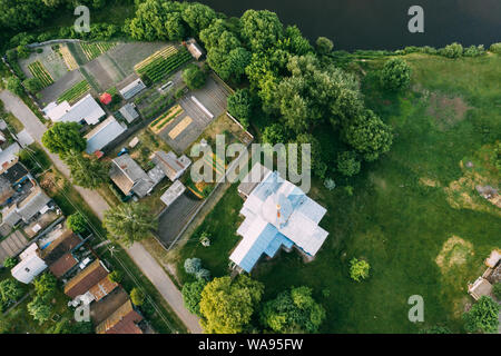 Golovintsy, Gomel Region, Belarus. Aerial View OF Village With Old Wooden Orthodox Church Of The Protection Of The Holy Virgin, Intercession Church At Stock Photo