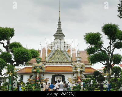 BANGKOK, THAILAND- JUNE, 21, 2017: wide shot of two giant demons in the grounds of wat arun temple in bangkok Stock Photo