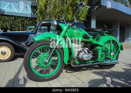 City Riga, Latvian republic. Retro car party. Oldtimer cars, motorcyle at the motor museum. Urban city view. 17 August 2019. Stock Photo