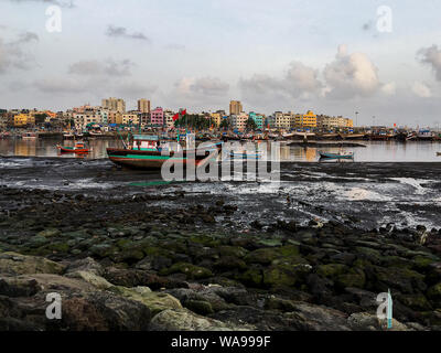 18 Aug 2019  Versova fisherman village skyline from Madh Island Ferry boat jetty near Andheri Mumbai Maharashtra India Stock Photo