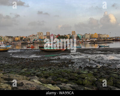 18 Aug 2019  Versova fisherman village skyline from Madh Island Ferry boat jetty near Andheri Mumbai Maharashtra India Stock Photo