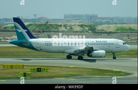 Singapore - Mar 28, 2019. 9V-SLO SilkAir Airbus A320 taxiing on runway of Singapore Changi Airport (SIN). Stock Photo