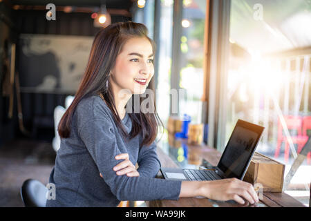 Asian business women using notebook working and Discussion of the important contract at office Stock Photo