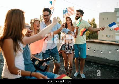 Happy group of young friends having fun in summer Stock Photo