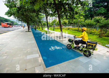 --FILE--The Qiaoxiang Road in Futian and Nanshan districts, which is Shenzhen's first 'smart road,' opens to public in Shenzhen city, south China's Gu Stock Photo