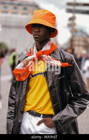 Trendy women and men pose for street snap during the Paris Fashion Week ...