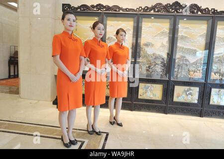 Chinese Hostesses Dressed In Cheongsam A Traditional Chinese Dresses Also Known As Qipao Pose At The Dalian Zhoushuizi International Airport Ahead O Stock Photo Alamy