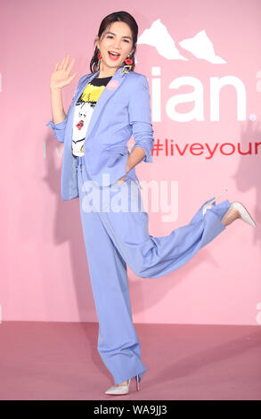 **TAIWAN OUT**Taiwanese singer Ella, or known as Chen Chia-hwa, attends a press conference of Evian, a French brand of mineral water, promoted Evian v Stock Photo