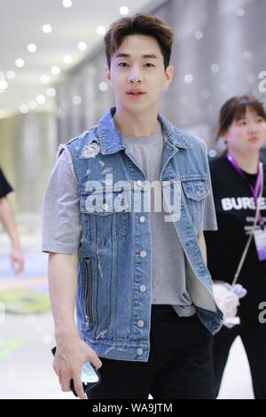 Canadian singer and actor Henry Lau arrives at the an airport after landing in Shanghai, China, 9 July 2019. Stock Photo